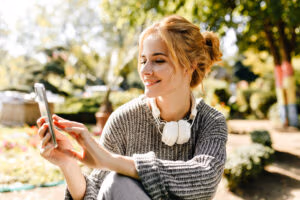 ACASĂ 7 woman sitting greenhouse takes selfie her phone