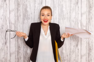 ACASĂ 5 front view young businesswoman strict clothes black jacket reading document white surface